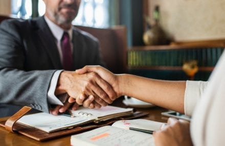 Divorce Attorney shaking hand with client